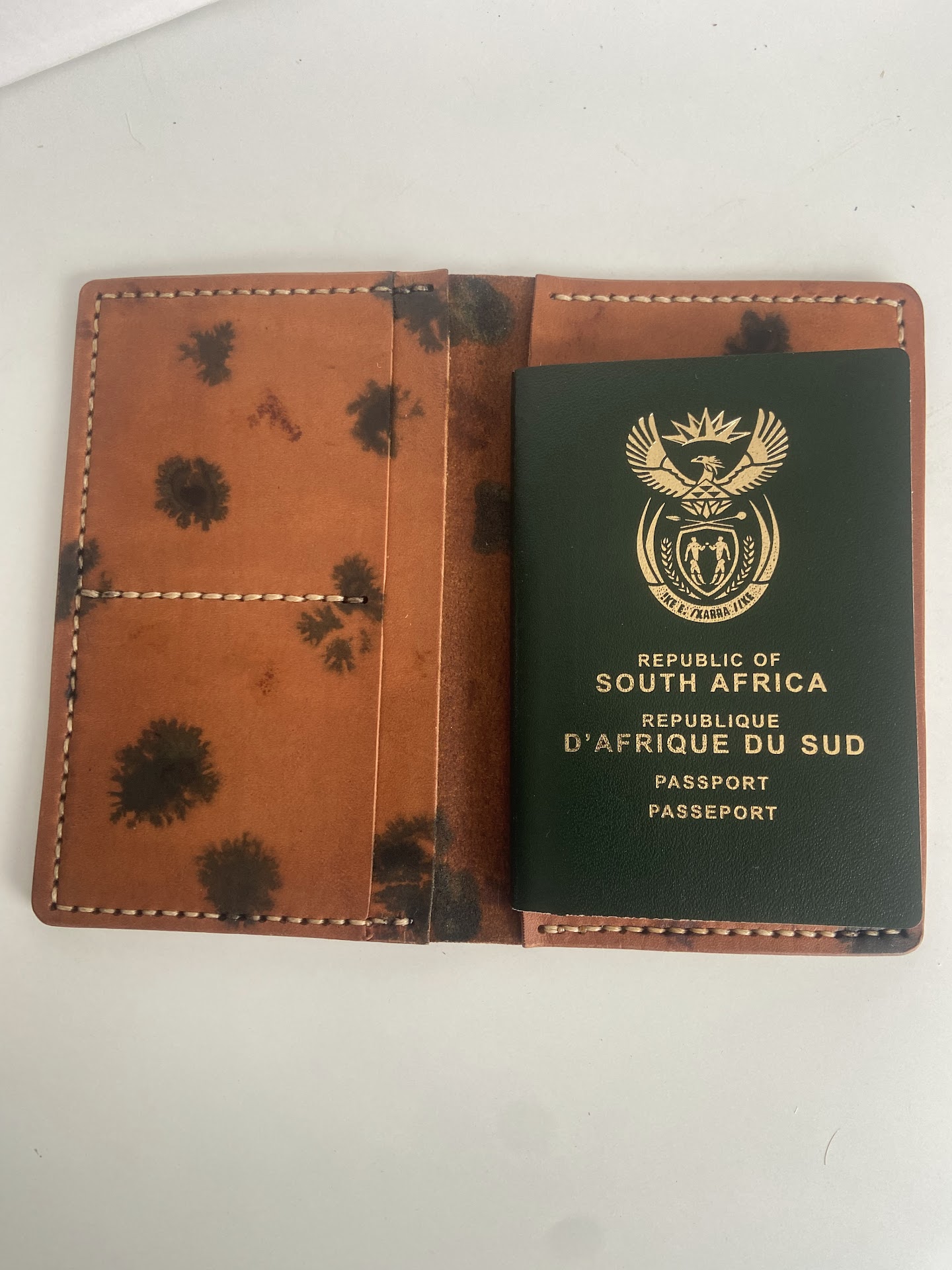Personalised leather passport cover with a South African passport