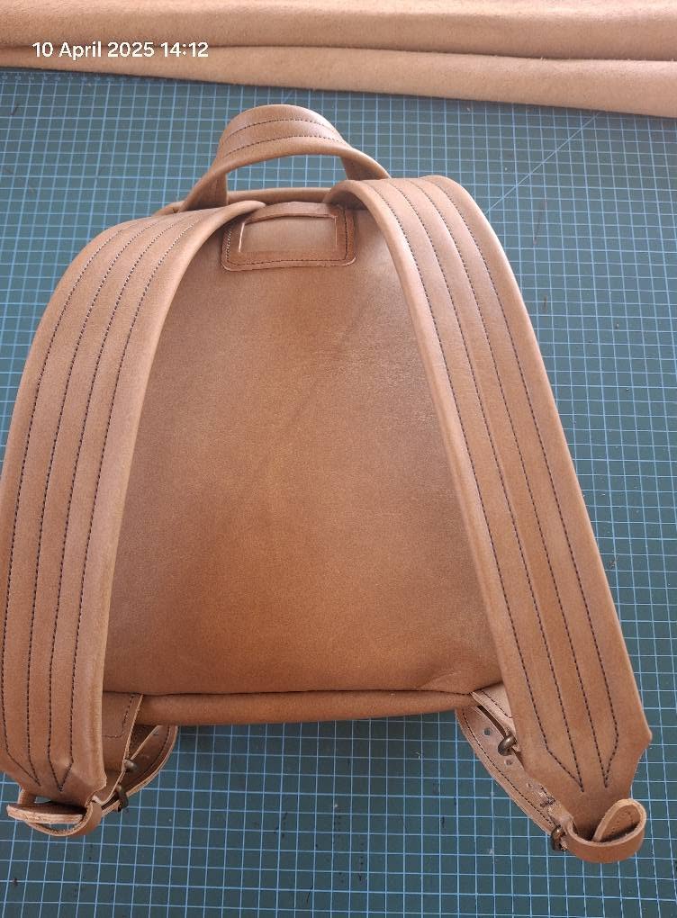 Tan leather backpack with double shoulder straps